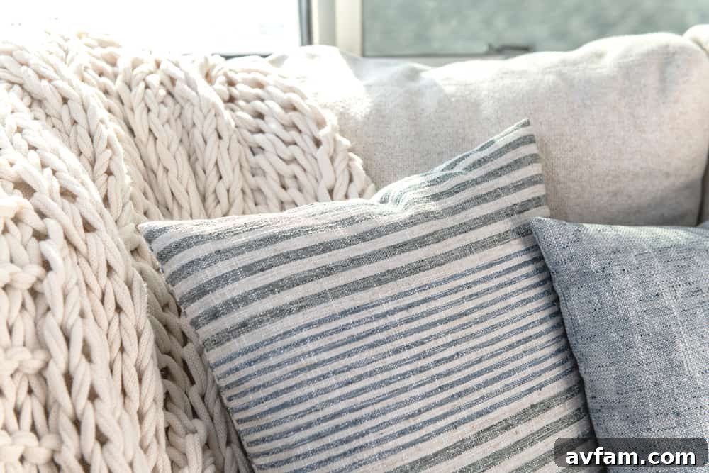 A detailed interior shot of the Airstream Pottery Barn living room, emphasizing comfortable seating and sophisticated décor elements.