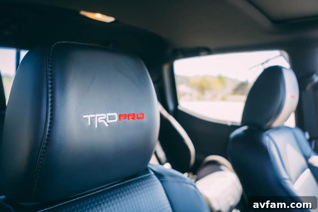 Close-up of the 2021 Tacoma TRD Pro's front wheel, tire, and suspension components