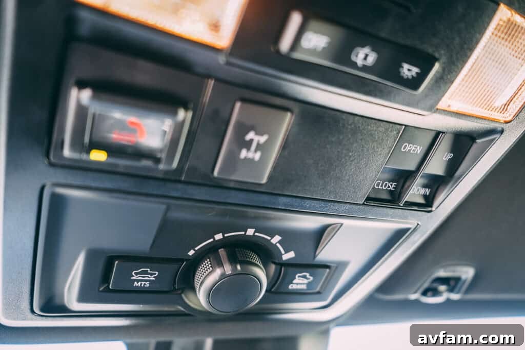 Central console and gear shifter of the 2021 Tacoma TRD Pro with red accents