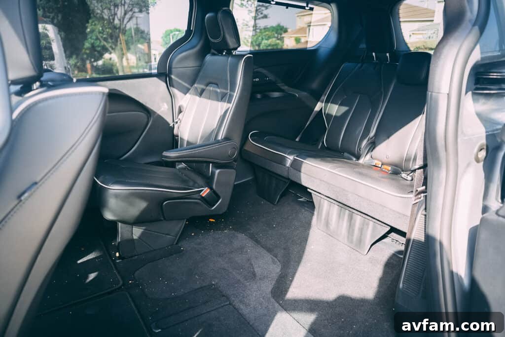 Rear-seat entertainment screens deployed in the Pacifica, ready for passenger enjoyment.