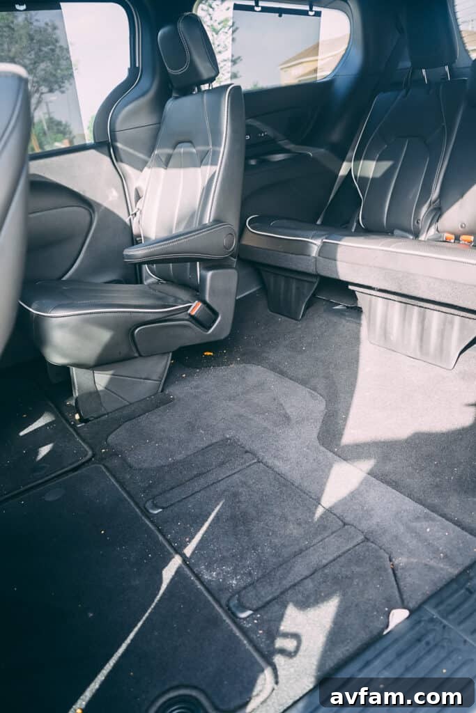 Cargo area of the Chrysler Pacifica with the third-row seats folded down, showing immense storage space.