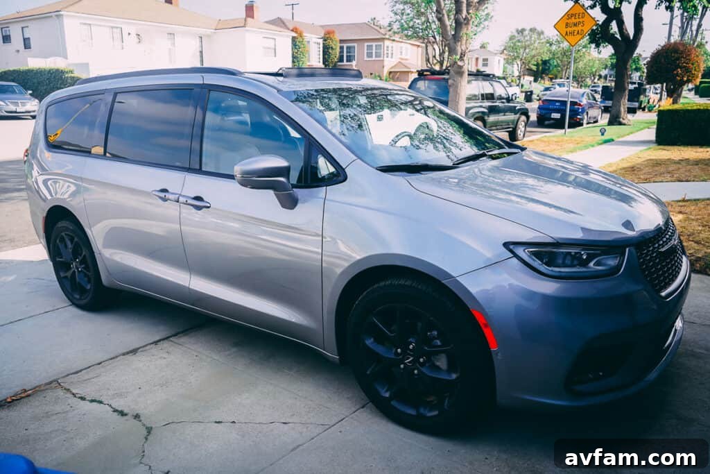 Detailed shot of the 2021 Chrysler Pacifica's front grille and LED headlights, highlighting its modern design.