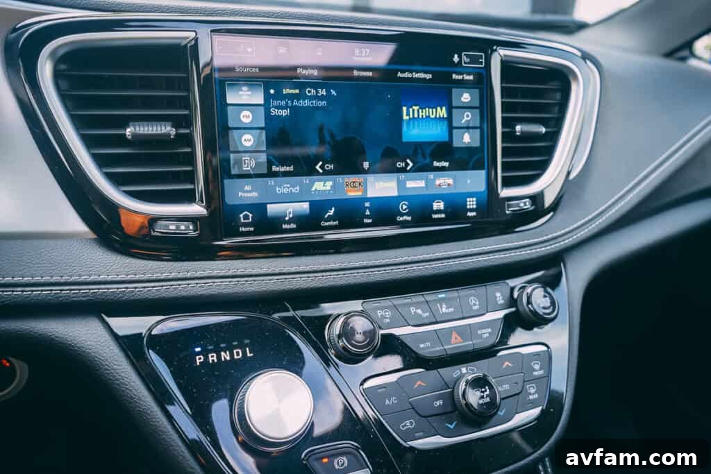 Interior shot of the Chrysler Pacifica's dashboard, featuring the Uconnect infotainment system.
