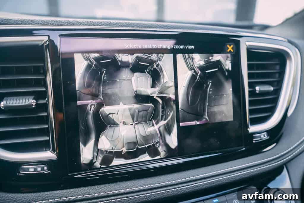 Driver's perspective of the Pacifica's cockpit, highlighting the steering wheel and instrument cluster.