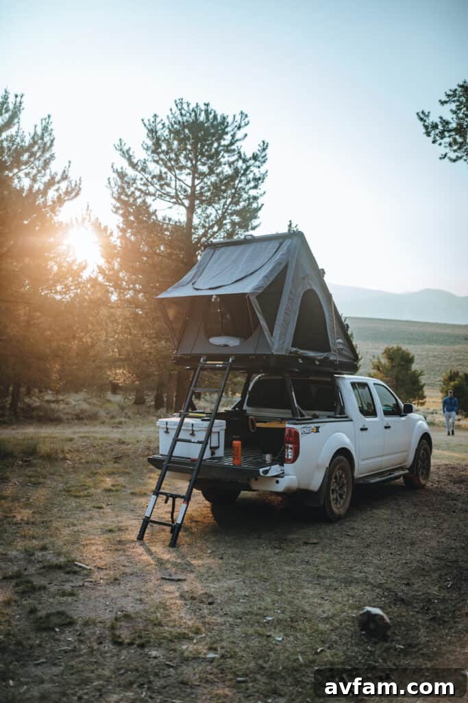 Interior view of a Land Cruiser organized for sleeping with comfortable camping gear and provisions