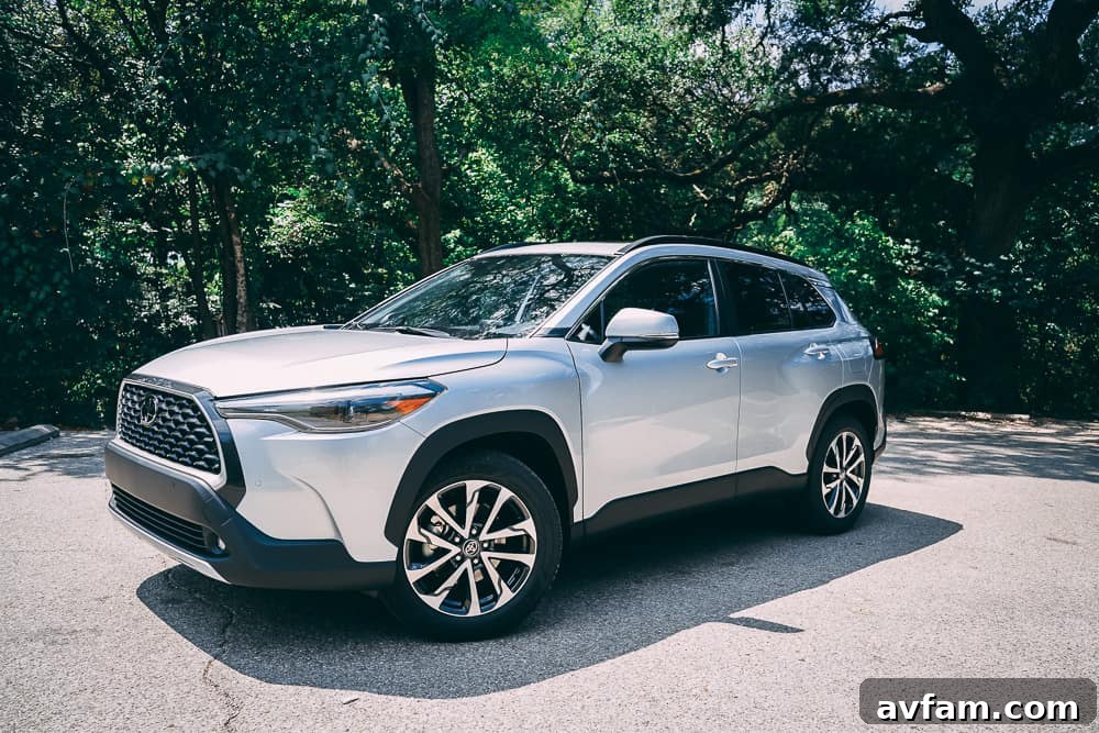 2022 Toyota Corolla Cross parked on a street with a city backdrop, showcasing its modern SUV design.