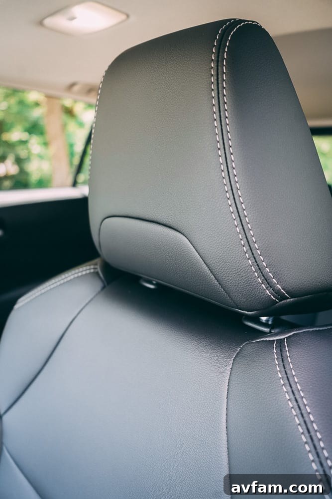 Driver's side door panel and interior handle of the 2022 Toyota Corolla Cross.