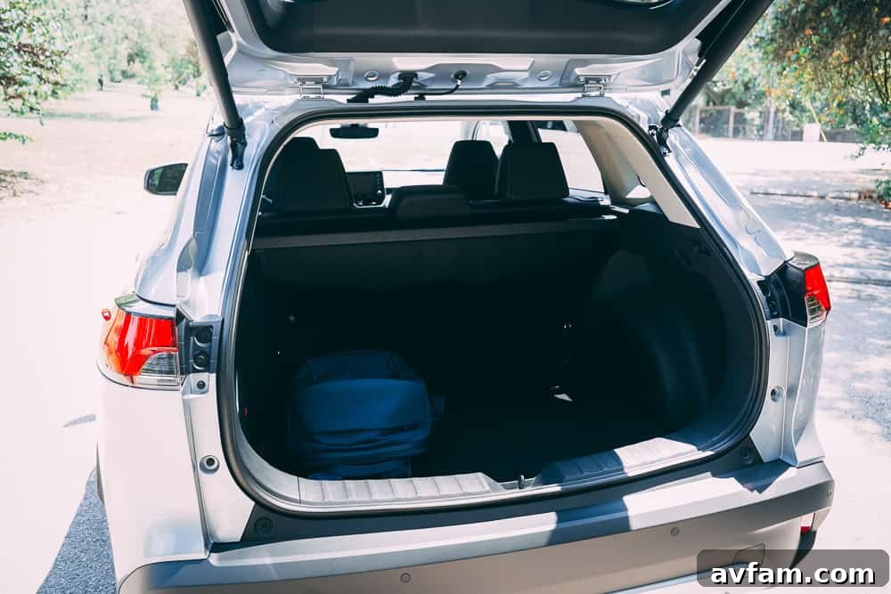 Rear cargo area of the 2022 Toyota Corolla Cross with the seats up, showing ample space.