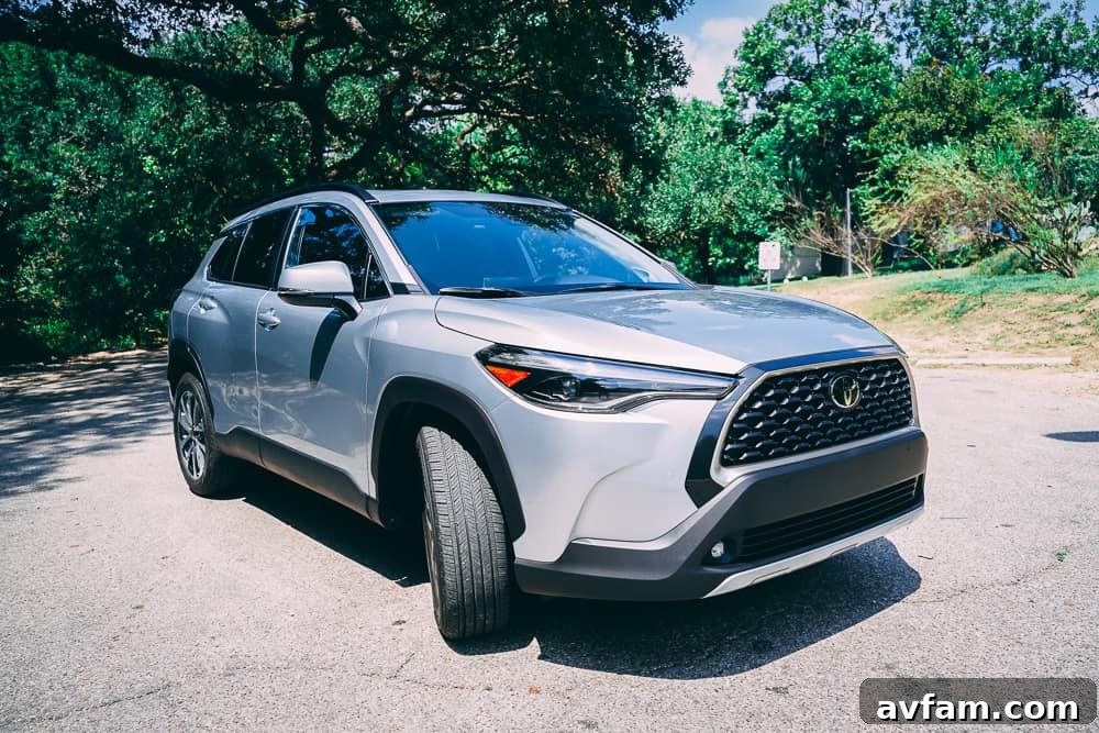 Interior shot focusing on the center console and cup holders of the 2022 Toyota Corolla Cross.