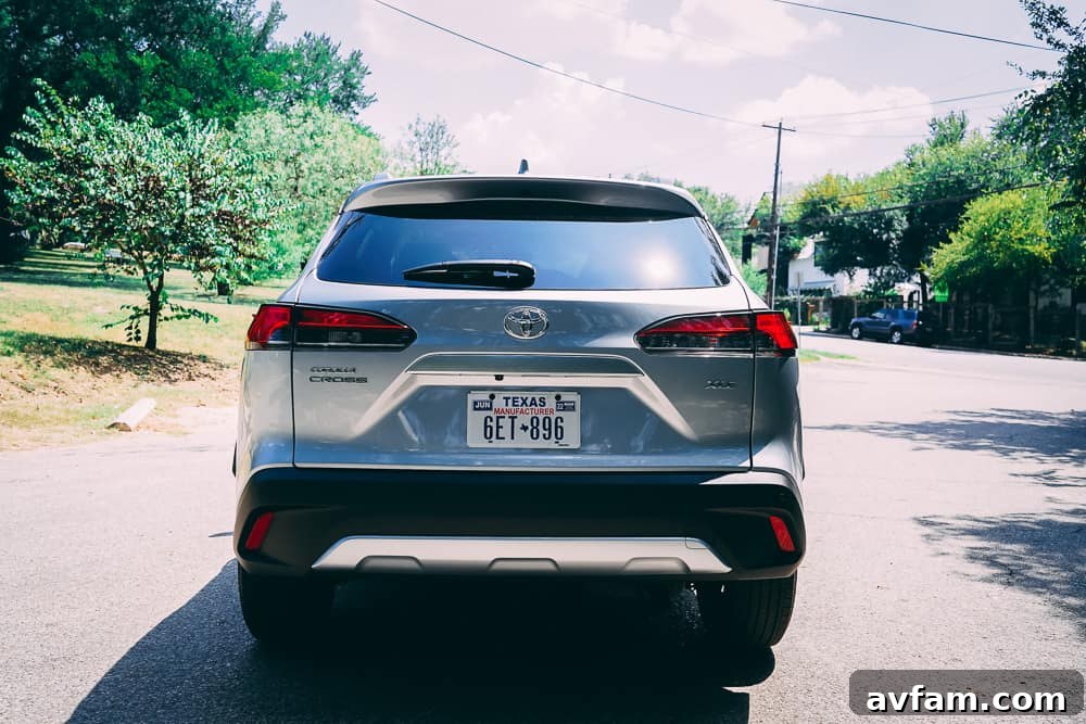 The 2022 Toyota Corolla Cross driving past a natural landscape.