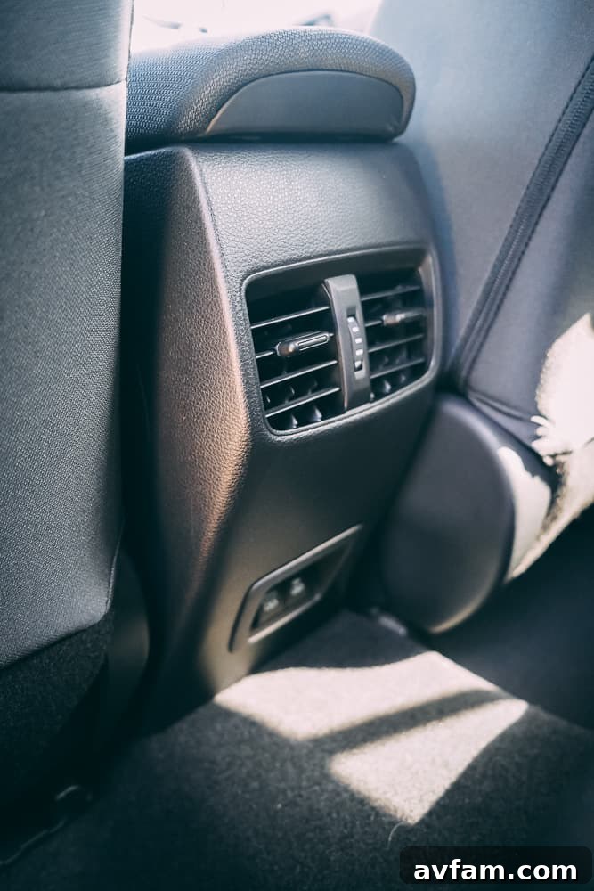 Close-up of the rear seats in the 2022 Toyota Corolla Cross, showing spaciousness and material quality.