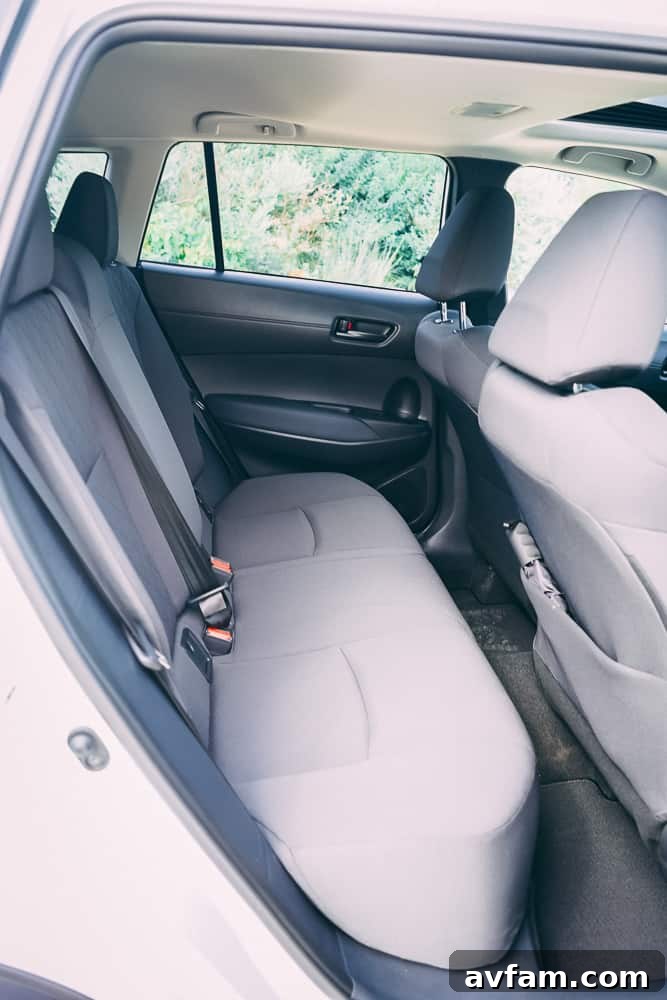 Detail shot of the rear door handle and window control in the 2022 Toyota Corolla Cross.