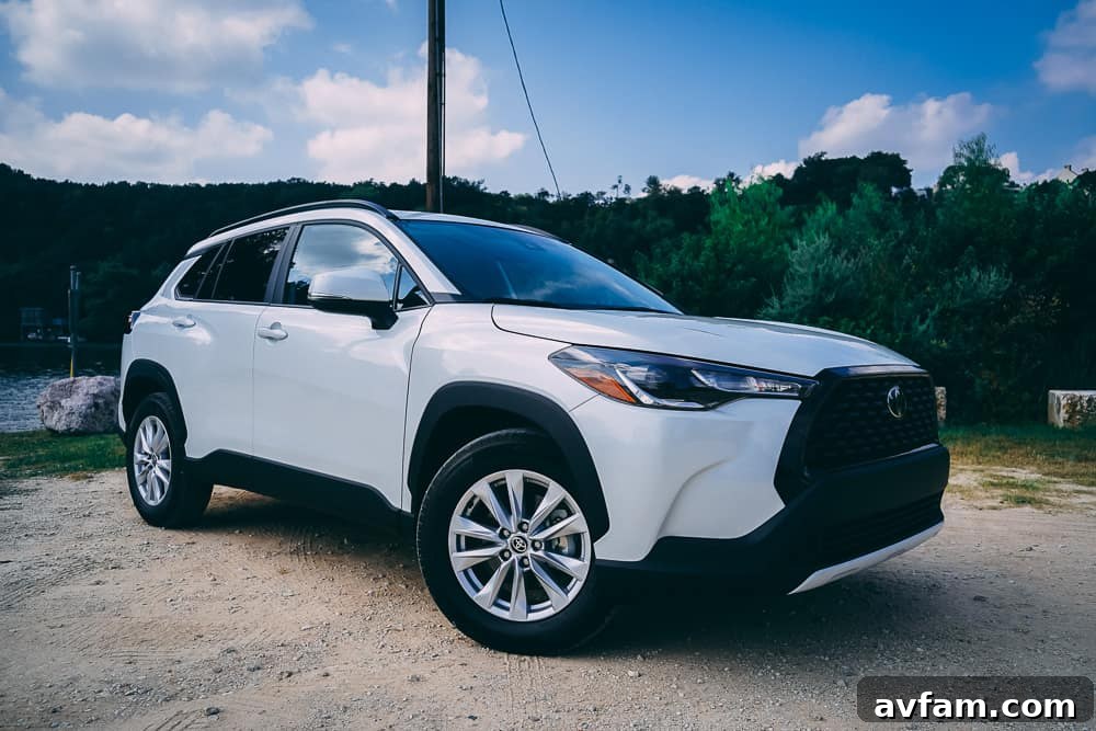 Front three-quarter view of the 2022 Toyota Corolla Cross in a dynamic driving shot.