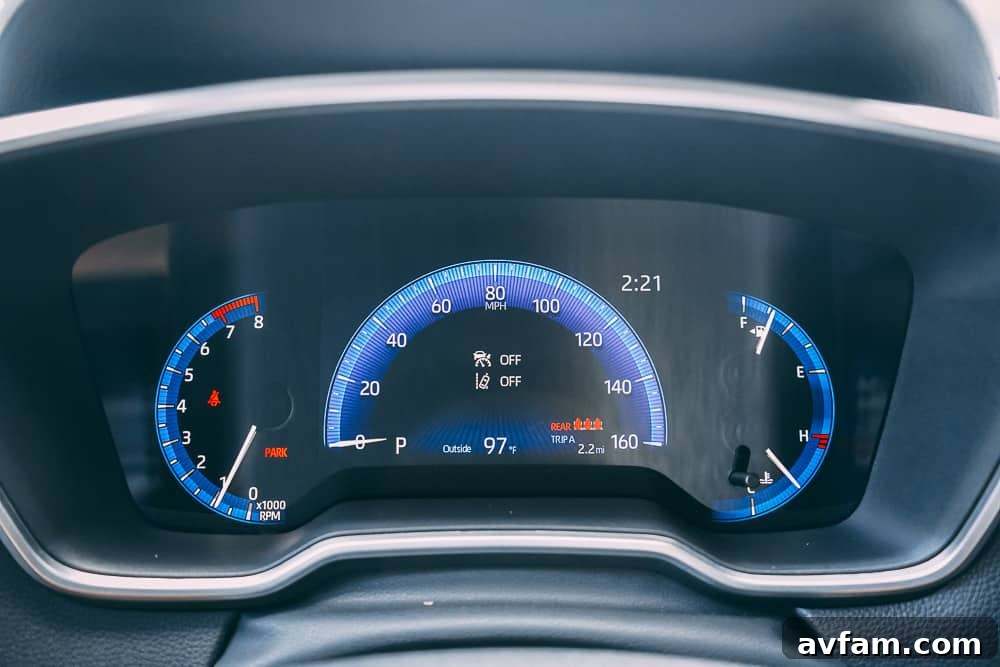 Close-up of the steering wheel and instrument cluster in the 2022 Toyota Corolla Cross, highlighting modern controls.