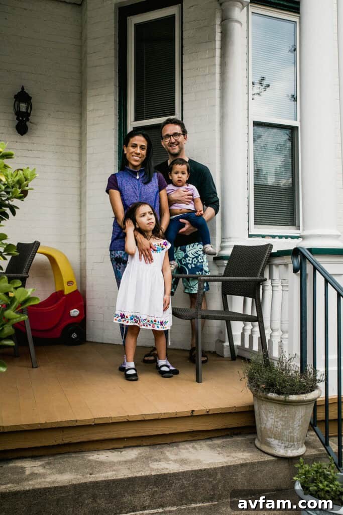 Richmond Restoration: A Historic House Reborn 2 Joe and Lulu with their daughters, Dani and Maya, on their front porch in Richmond, VA after their historic home renovation