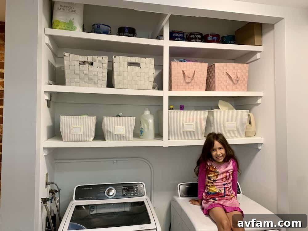 Richmond Restoration: A Historic House Reborn 12 After renovation: Open concept hallway laundry area with white interior and storage bins in a historic Richmond home