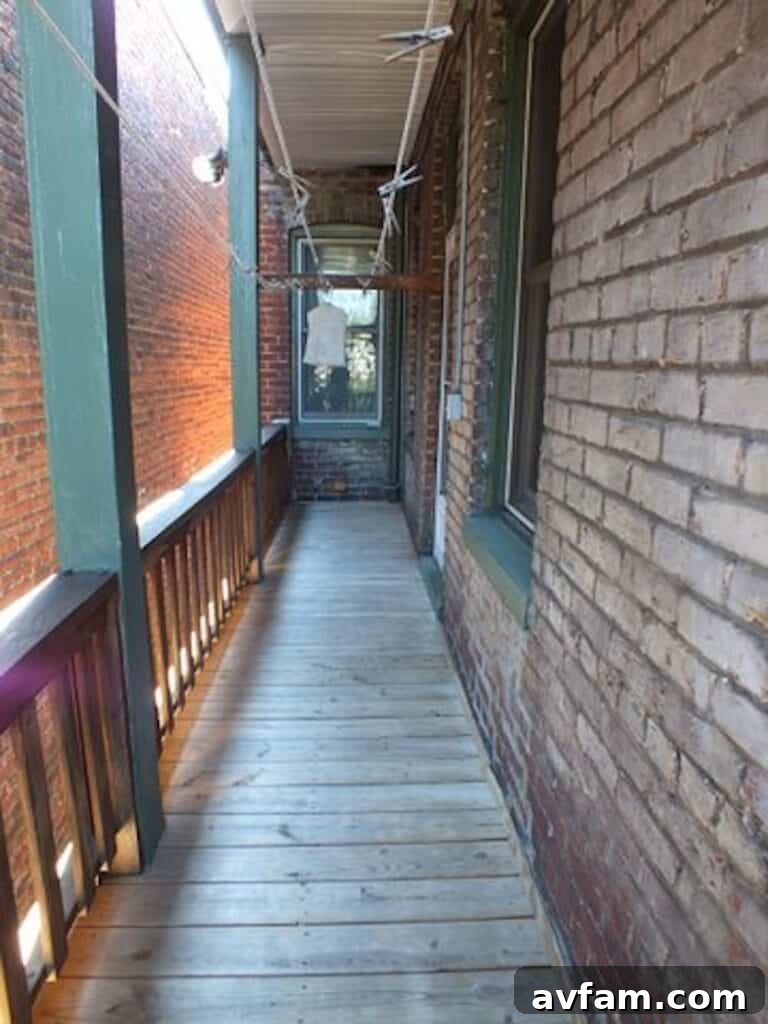 Richmond Restoration: A Historic House Reborn 28 Before renovation: Worn second-floor deck and brick walls of a historic Richmond VA home