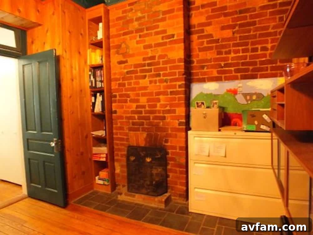 Richmond Restoration: A Historic House Reborn 8 Before renovation: Detailed view of the dark paneled walls and tin ceiling in an old house office