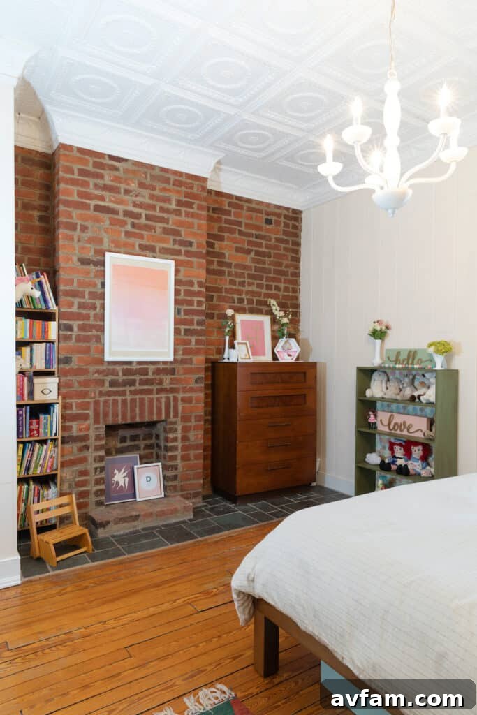 Richmond Restoration: A Historic House Reborn 10 After renovation: Cozy girls' bedroom with a fireplace and modern decor in a historic Richmond VA house