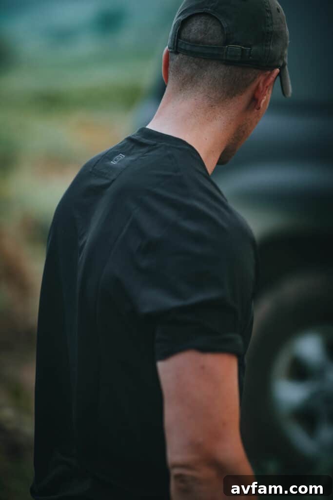 5.11 Recon Charge Shirt: Lightweight and Ventilated Person wearing 5.11 Tactical Recon Charge Short-Sleeve Shirt in an outdoor setting