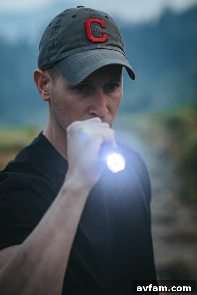 5.11 Response XR1 Flashlight: EDC and Trail Essential Person holding a 5.11 Tactical Response XR1 Flashlight outdoors at night
