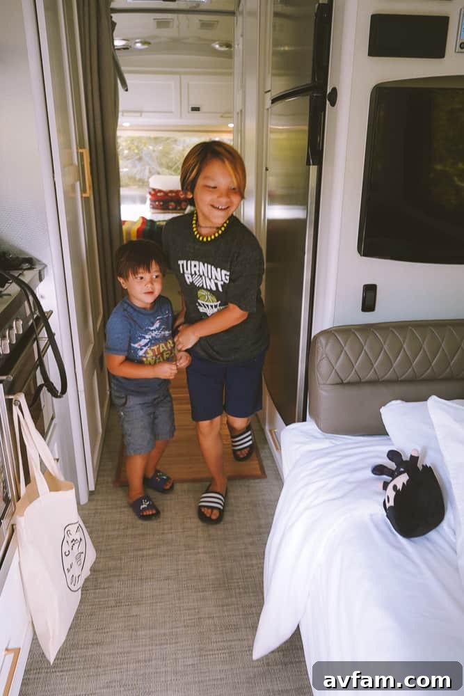 A family relaxing and enjoying the comforts of their Airstream glamping experience.