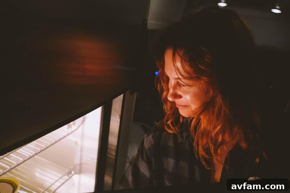 The exterior of an Airstream with its awning extended, creating a shaded outdoor living space.