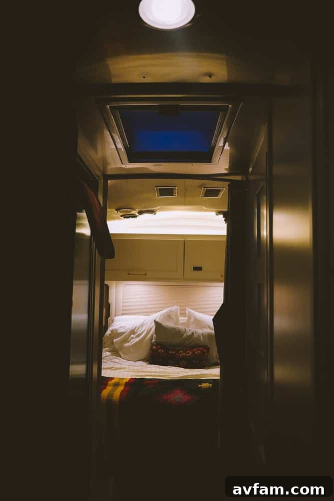 A close-up of an Airstream's polished aluminum exterior, reflecting the Ojai surroundings.