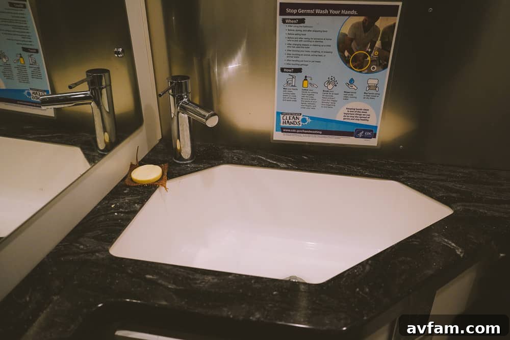 The bathroom facilities inside an Airstream, showcasing modern design and cleanliness.