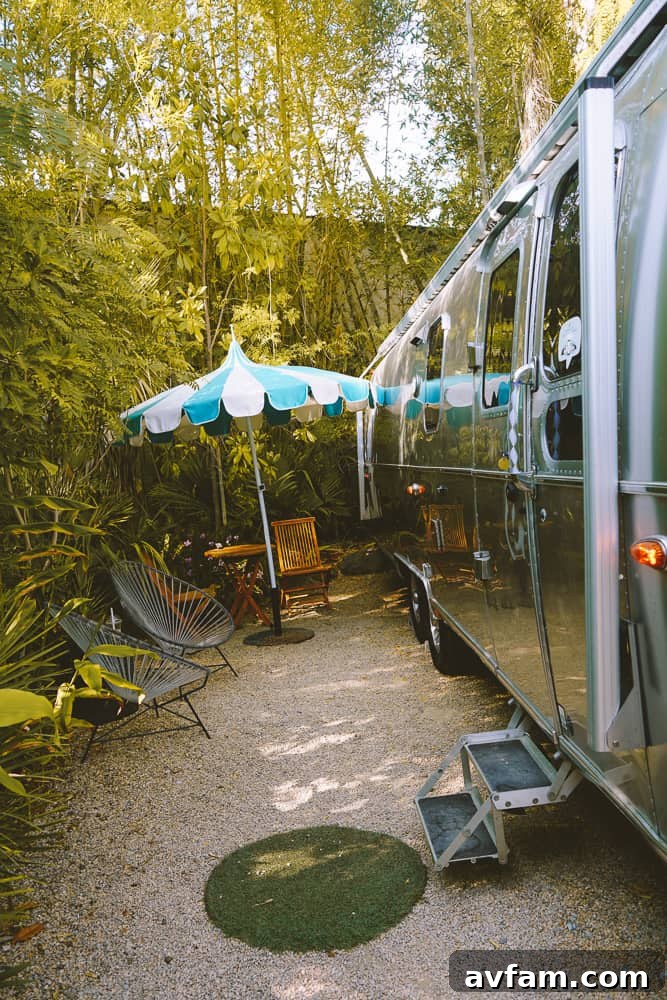 A guest enjoying a book on the comfortable outdoor seating at Caravan Outpost.