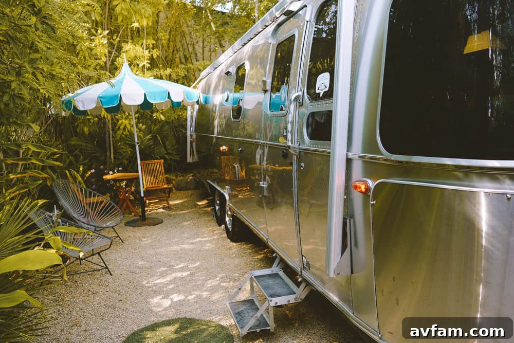 A view of the communal area at Caravan Outpost, with comfortable seating and fire pits, surrounded by Airstream trailers.