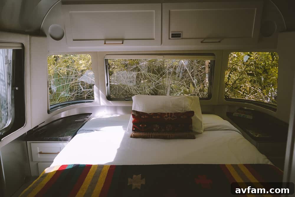 A child looking out the window of the Airstream, enjoying the view.
