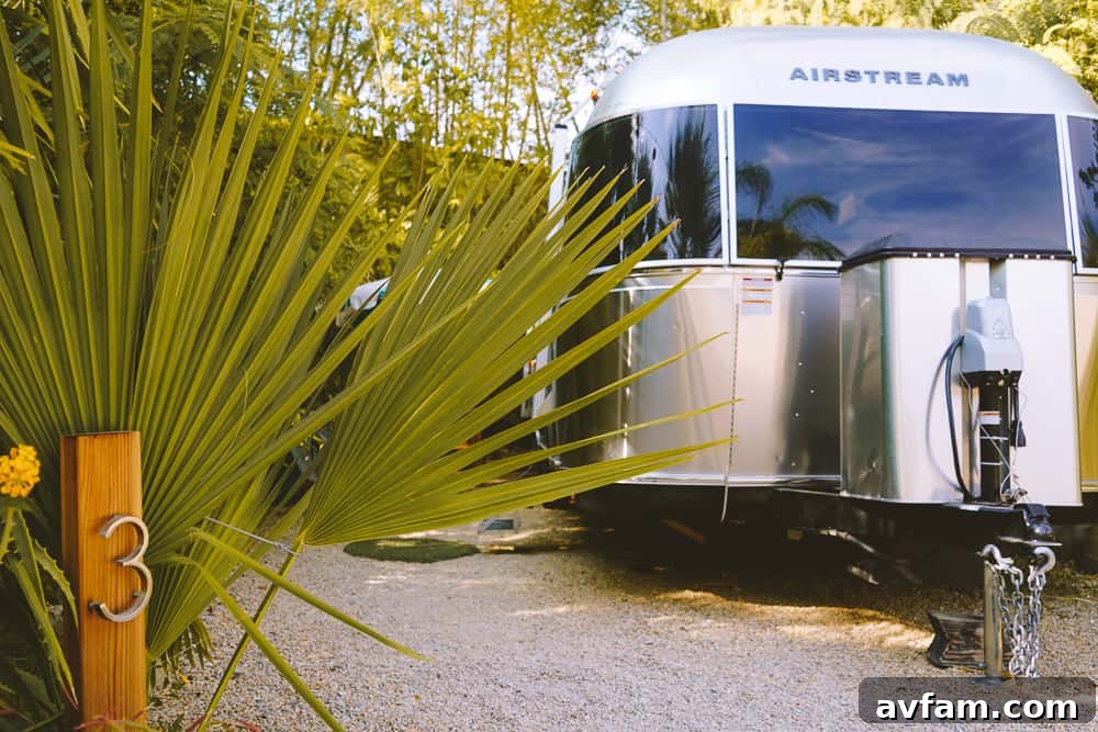 A comfortable queen bed inside the Airstream, indicating a luxurious camping experience.