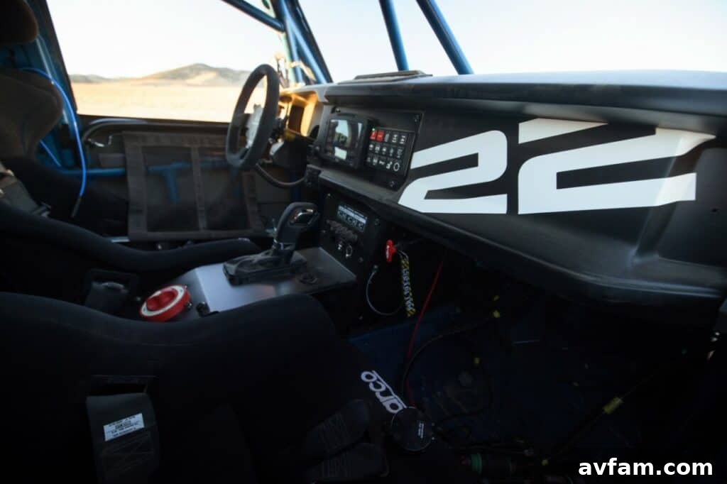 Ford Bronco DR: Conquer Baja Dreams 7 Dynamic shot of the Ford Bronco DR kicking up dust in the desert