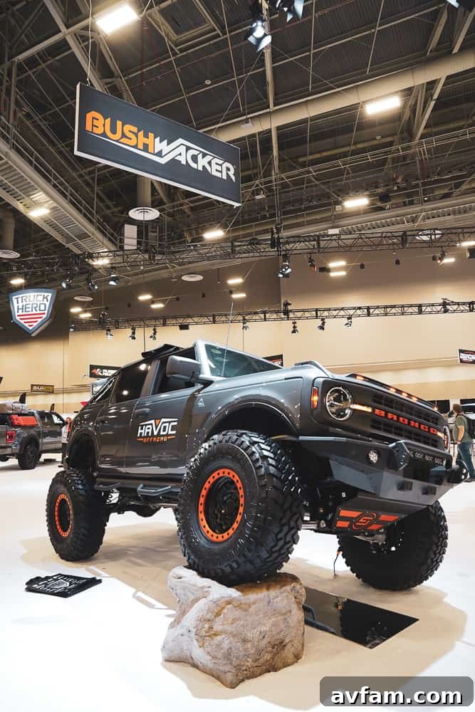 Custom Ford Bronco at SEMA Side view of a lifted Ford Bronco with large tires and overland roof rack at SEMA