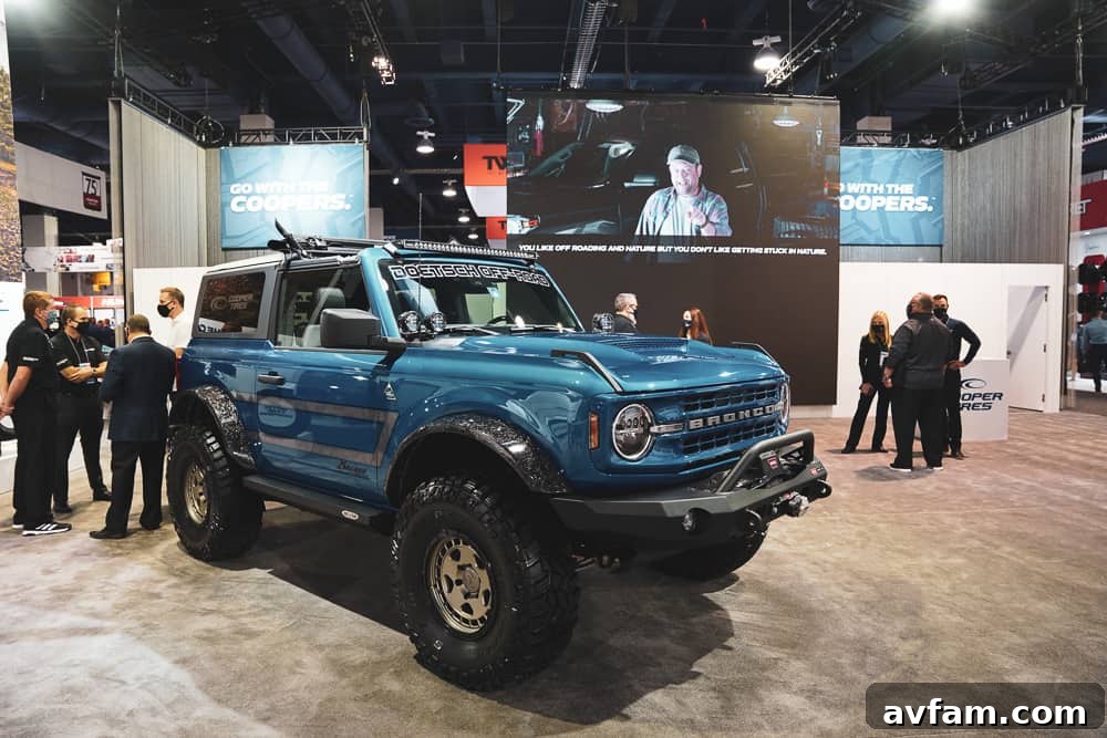 Custom Ford Bronco at SEMA Custom blue Ford Bronco with unique hood scoop and aggressive front grille at SEMA