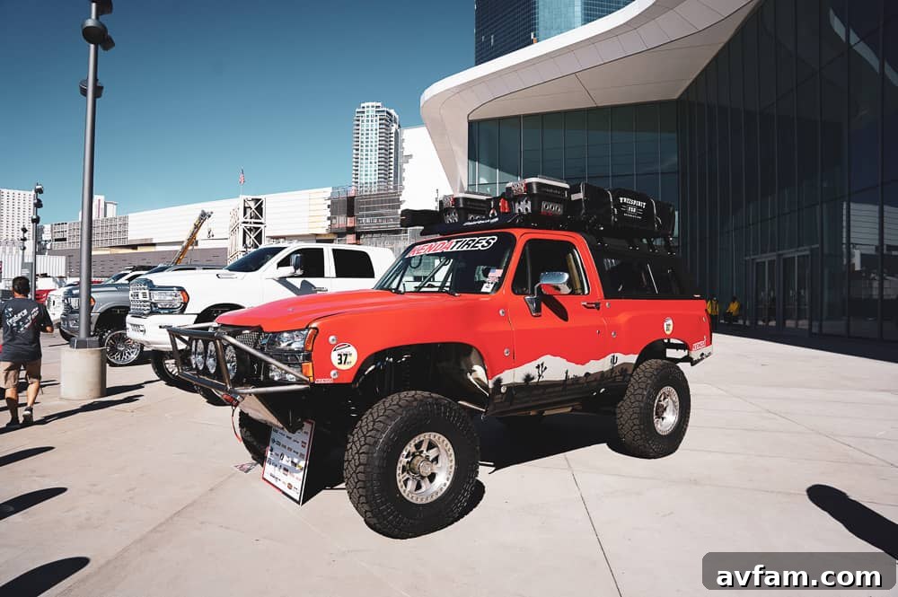 A highly stylized custom truck featuring unique body modifications and a vibrant paint scheme.