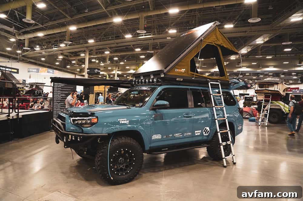 An imposing custom Ford Super Duty truck with massive tires, a lift kit, and a prominent front bumper.