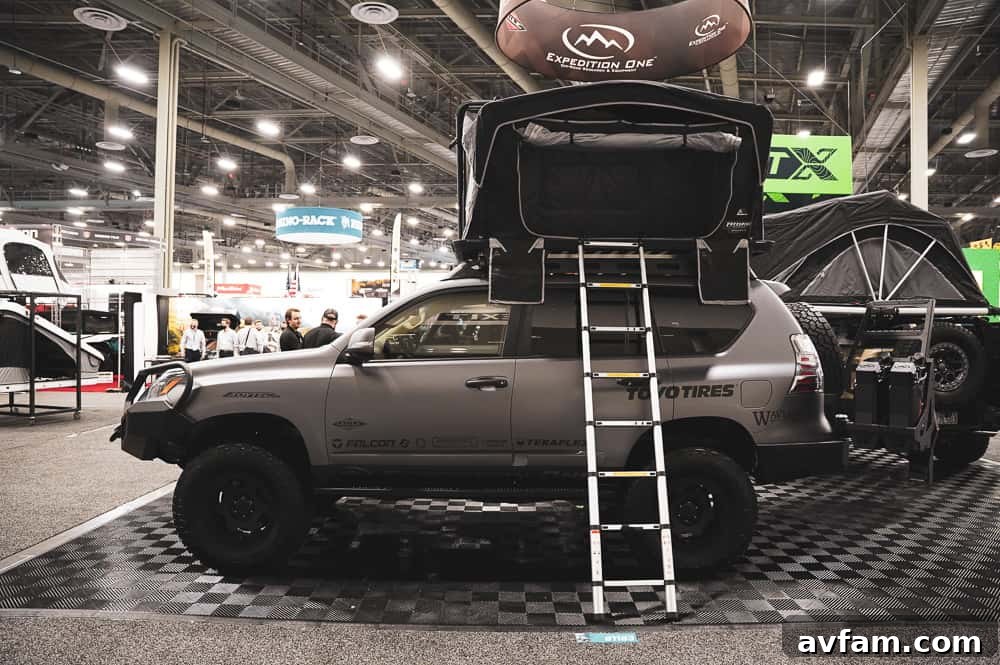 An aggressive custom off-road truck with a massive front bumper, winch, and prominent LED light bars.