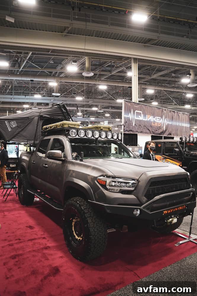 Detailed view of a unique wheel design paired with a rugged all-terrain tire, perfect for custom trucks.