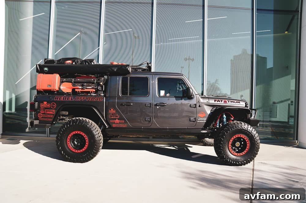 A powerful off-road build featuring an aftermarket grille, a winch, and auxiliary lighting for night trails.