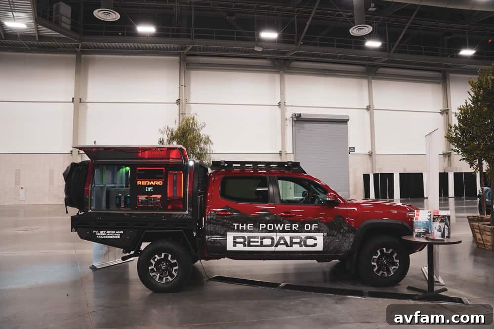 A custom Ford Bronco with a rooftop tent and integrated camping accessories, perfect for overlanding.