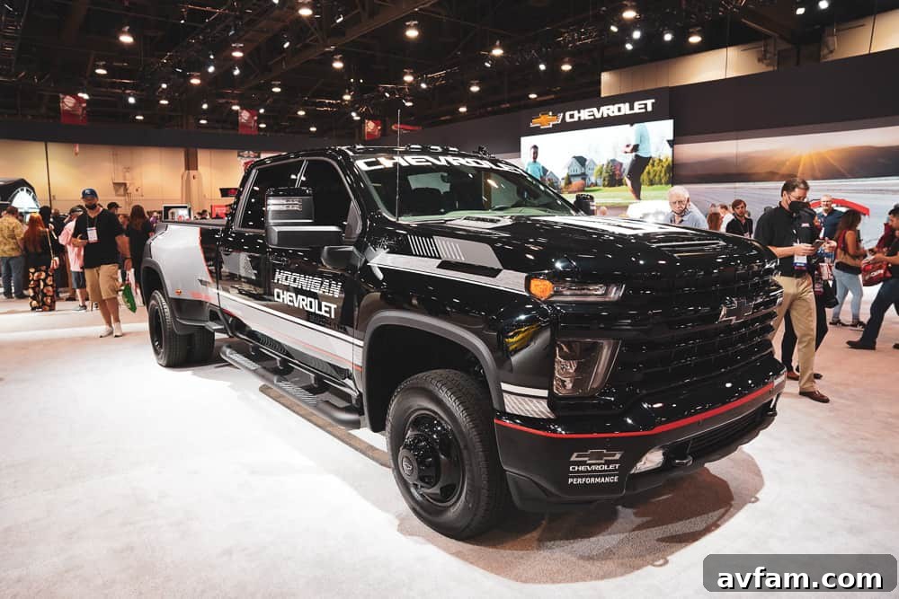 A custom Ford F-Series truck with an imposing front grille, oversized tires, and a high-performance exhaust.