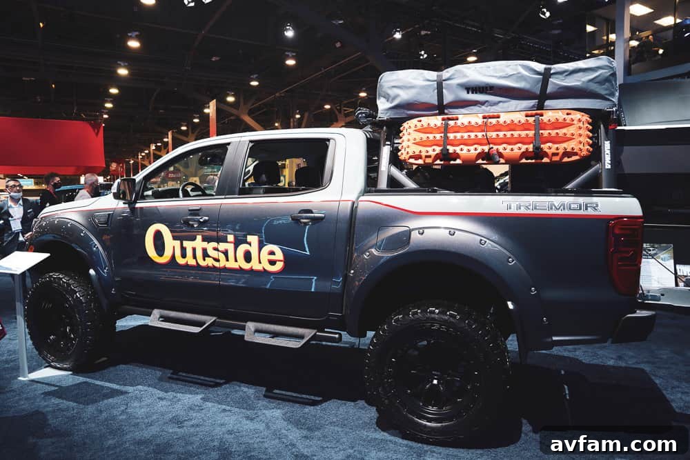 A custom Ford Bronco with unique styling cues, including fender flares and integrated auxiliary lights.