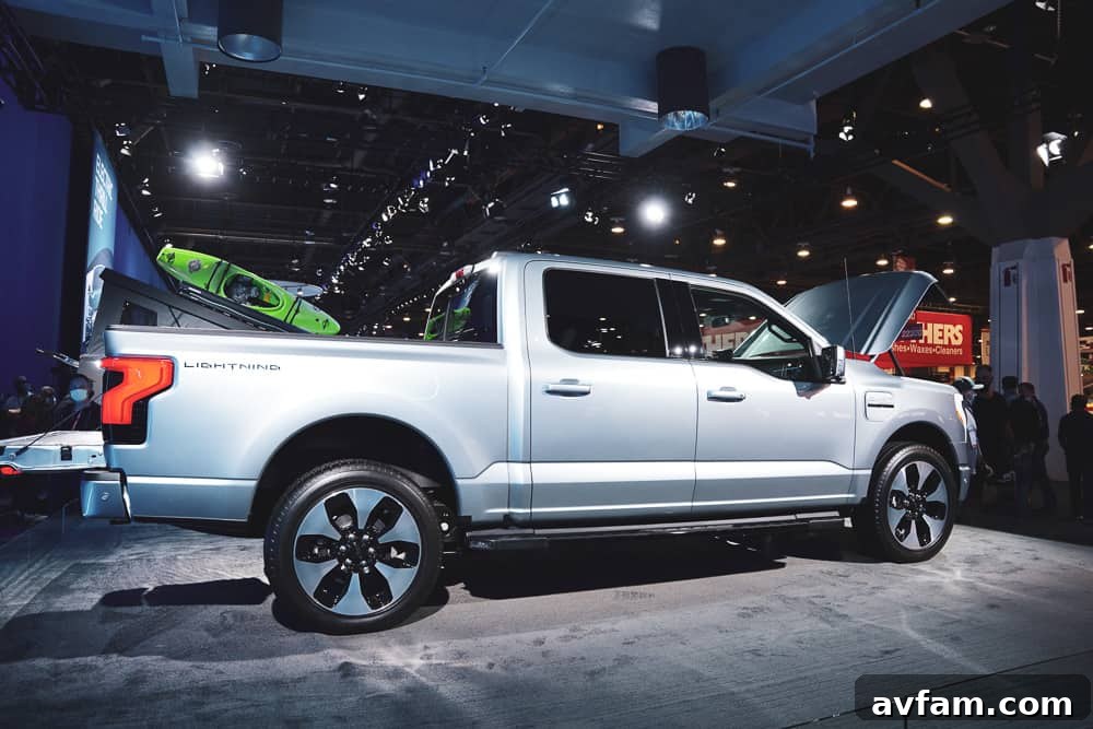 A custom truck with a vibrant paint scheme and custom graphics, drawing attention on the show floor.