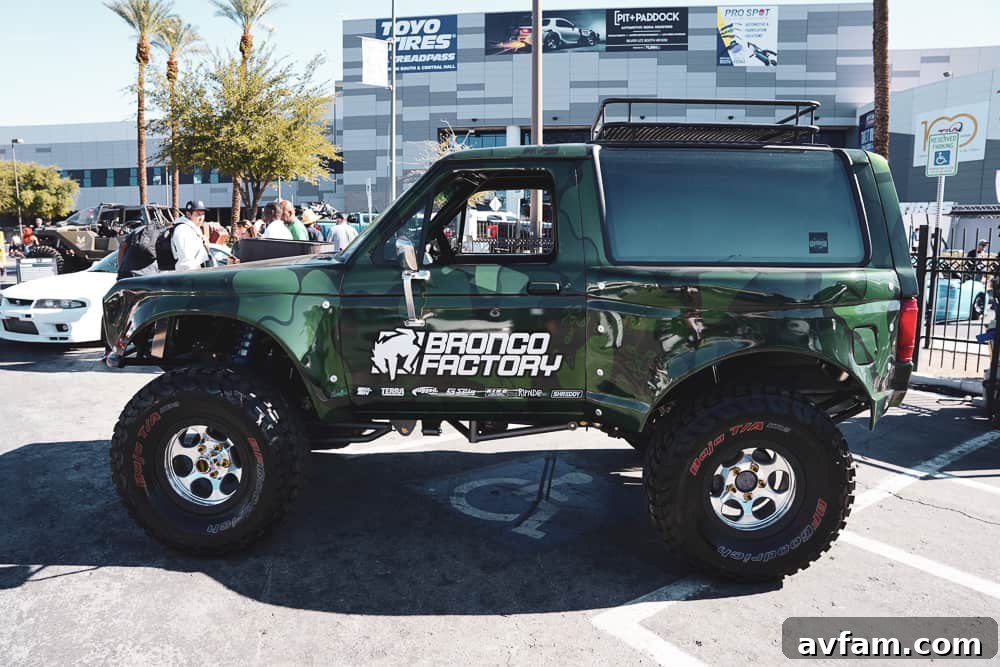 Another perspective of a custom Ford Bronco, highlighting its customized rear bumper and spare tire mount.