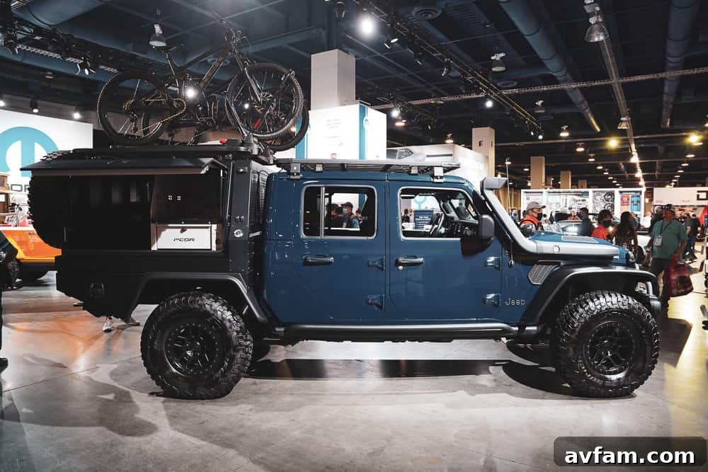 A powerful custom truck showcasing a heavy-duty suspension system and large mud-terrain tires.