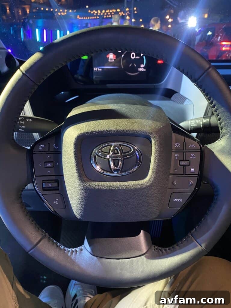 Close-up of the Toyota bZ4X's modern front grille and headlight design