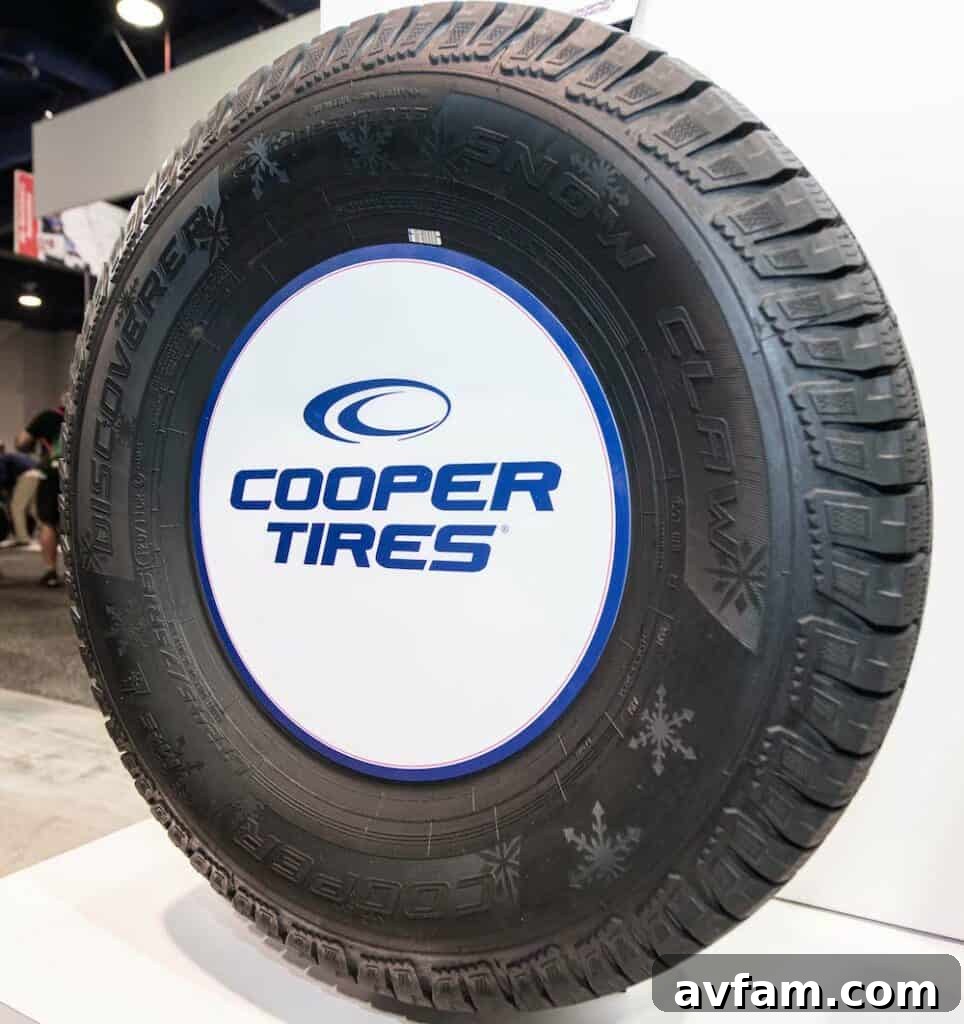 Cooper Discoverer Snow Claw Winter Performance Promotional image of Cooper Discoverer Snow Claw tire in a winter setting