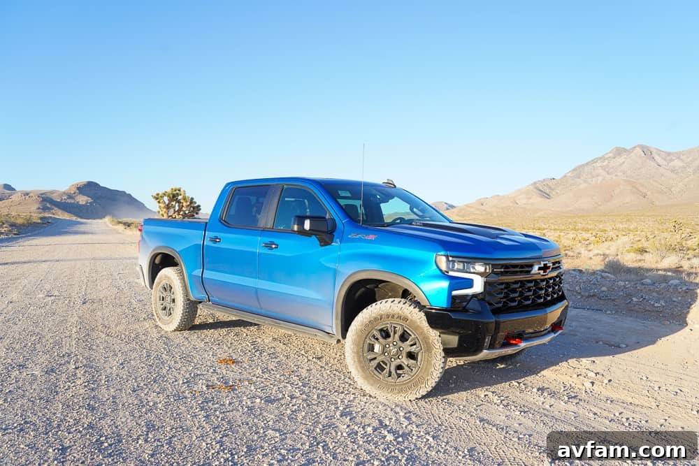 Chevy Silverado ZR2 driving through muddy terrain